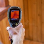 close up view lcd screen hand held infrared thermal imagery camera hand home inspector
